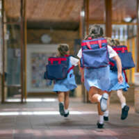 Excited students running towards entrance prep school 2020 06 04