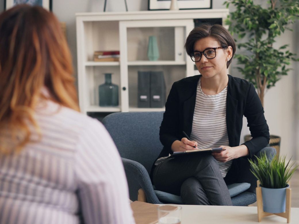 A consultant and student reviewing subject choices together